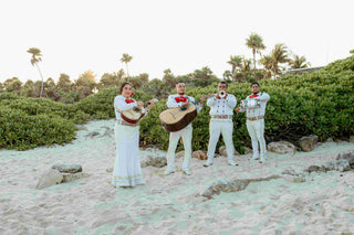 Photograph of a Mexican wedding band playing at a beach ceremony