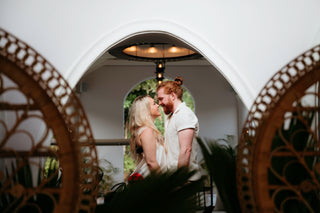 Photograph of couple embracing in the lobby of their hotel in St. Lucia