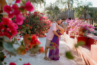 Photograph of a couple embracing in their beach-side hotel, taken by a DreamArt Photographer