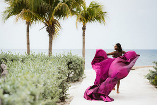 A model posing for a flying dress photoshoot in Montego Bay Jamaica
