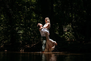 Photograph of a couple embracing in water, taken by a DreamArt Photography photographer