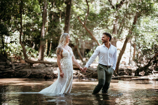Photograph of a couple walking in water, taken by a DreamArt Photography photographer