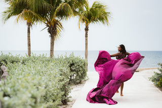 Flying dress photoshoot with photographer in front of the ocean at Breathless Montego Bay spa & resort in Jamaica
