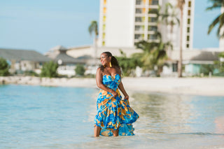 Model posing in the sea with long flowy dress during boudoir lifestyle photoshoot in Montego Bay