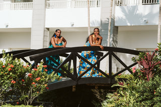 Lifestyle photoshoot with photographer capturing sisters on bridge at Secrets Wild Orchid Montego Bay in Jamaica