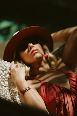 Photoshoot by photographer of woman sunbathing in hammock at Viceroy Riviera Maya