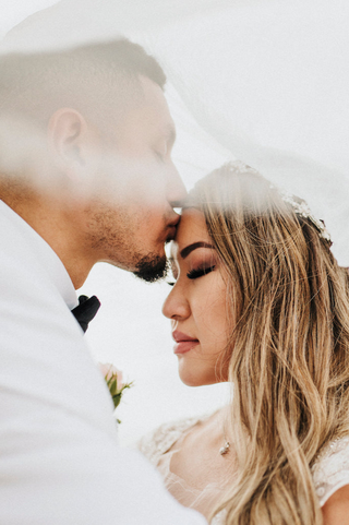 Wedding photography photoshoot with romantic couple on beach at Viceroy Riviera Maya a luxury villa resort