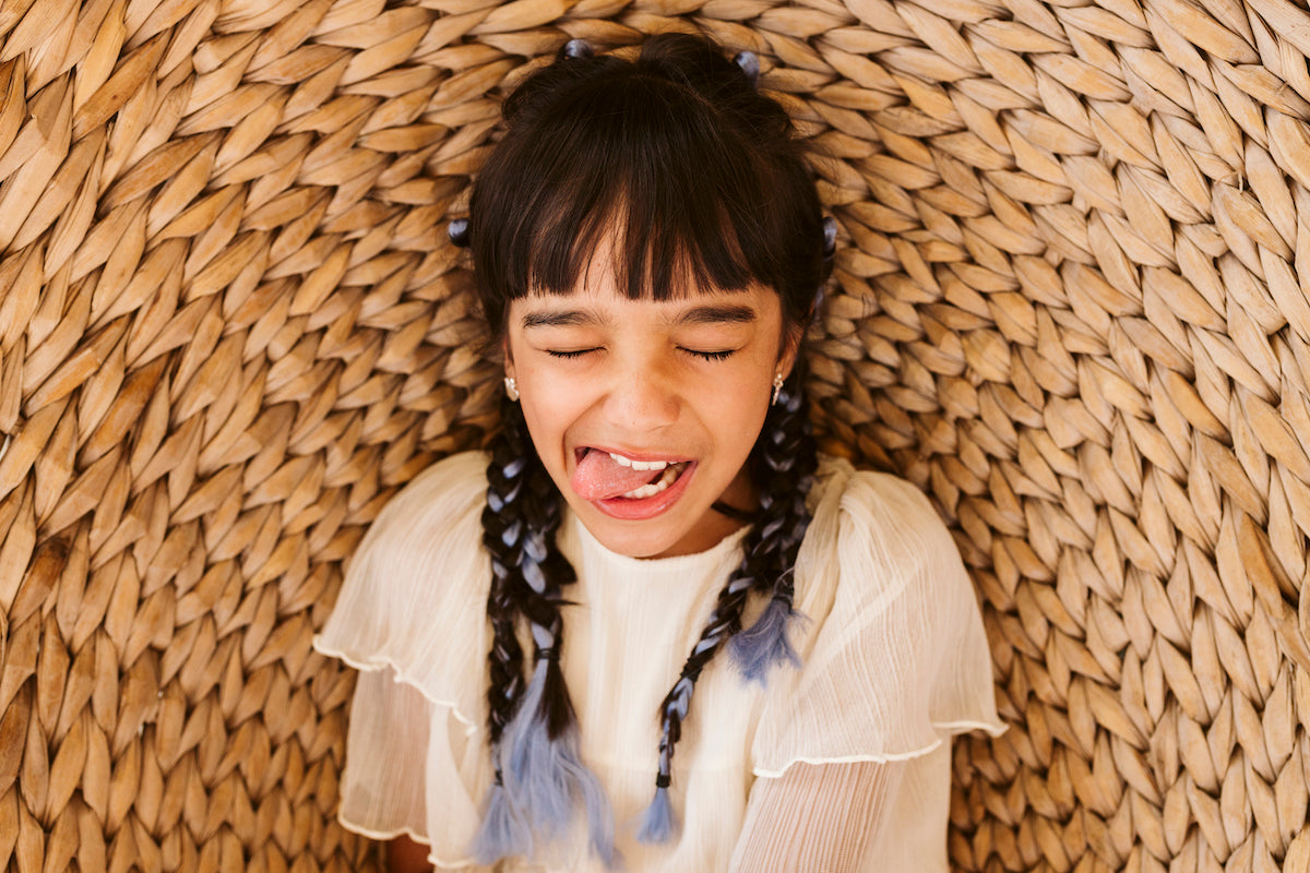 FUNNY FACE OF A KID DURING A PHOTOSHOOT
