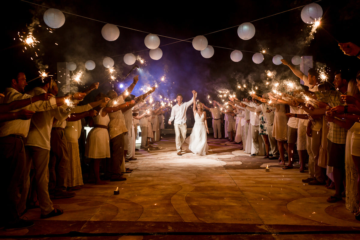 Newlyweds entrance with the guests with sparkles