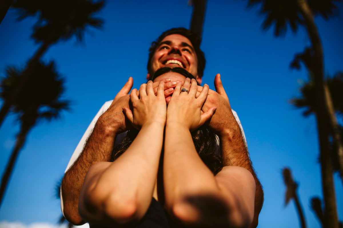 man hide the eyes of her girlfriend