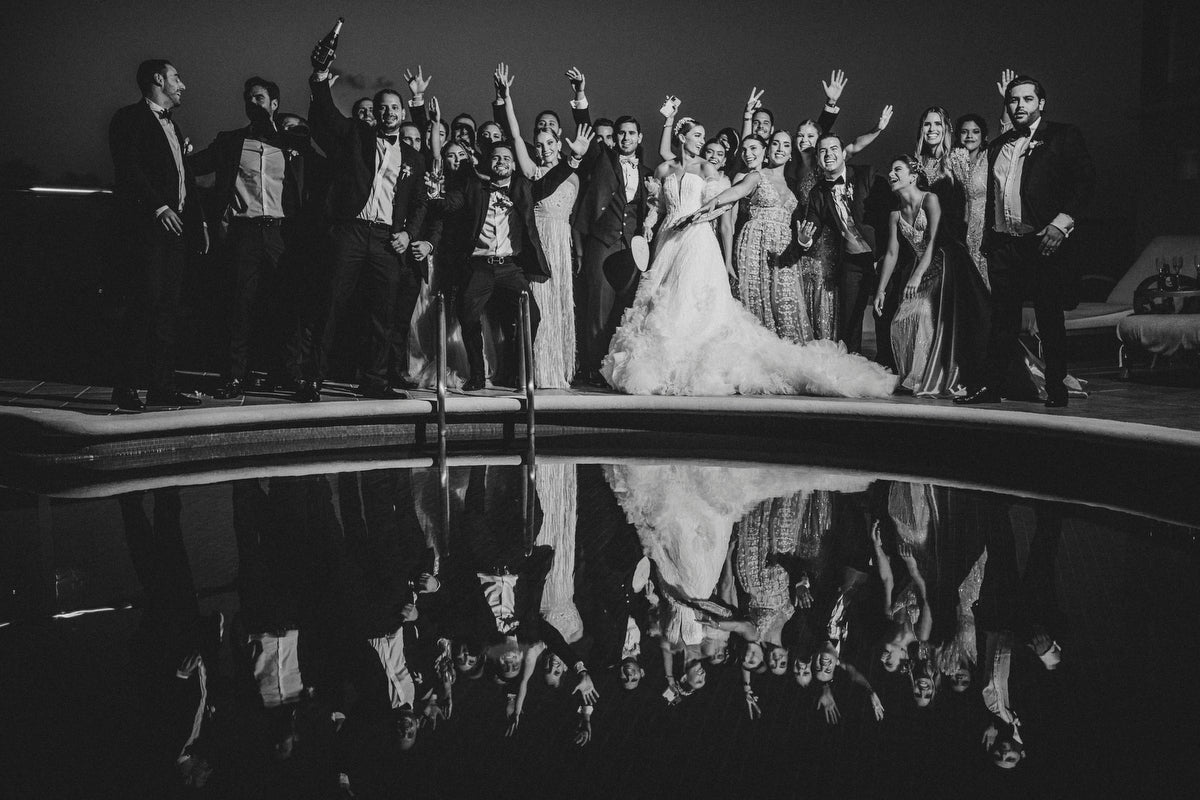 Wedding party at the pool of fiesta americana coral beach