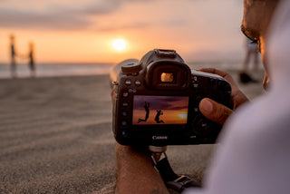 Photographer with canon camera in the sunset at Vallarta
