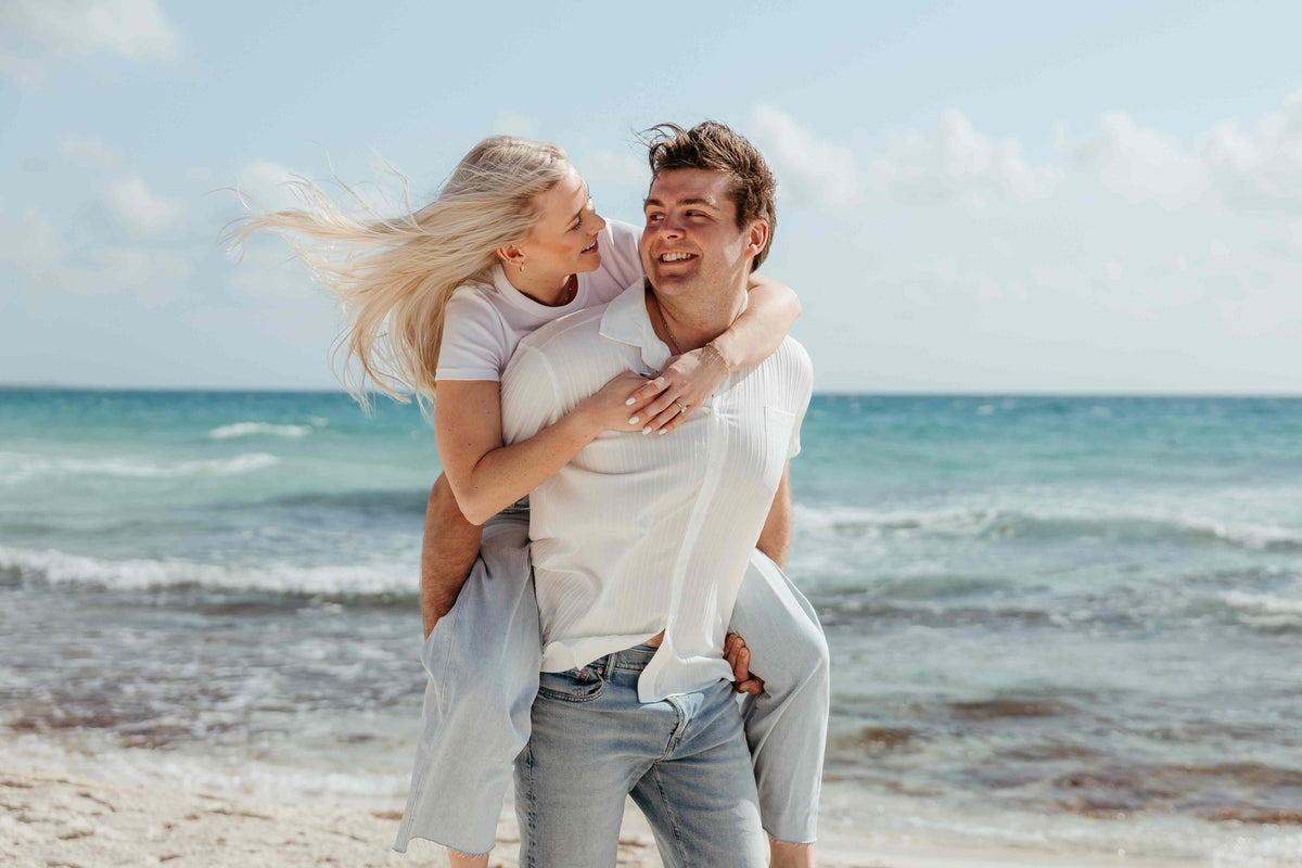 Photograph of couple on the beach, captured by a DreamArt photographer