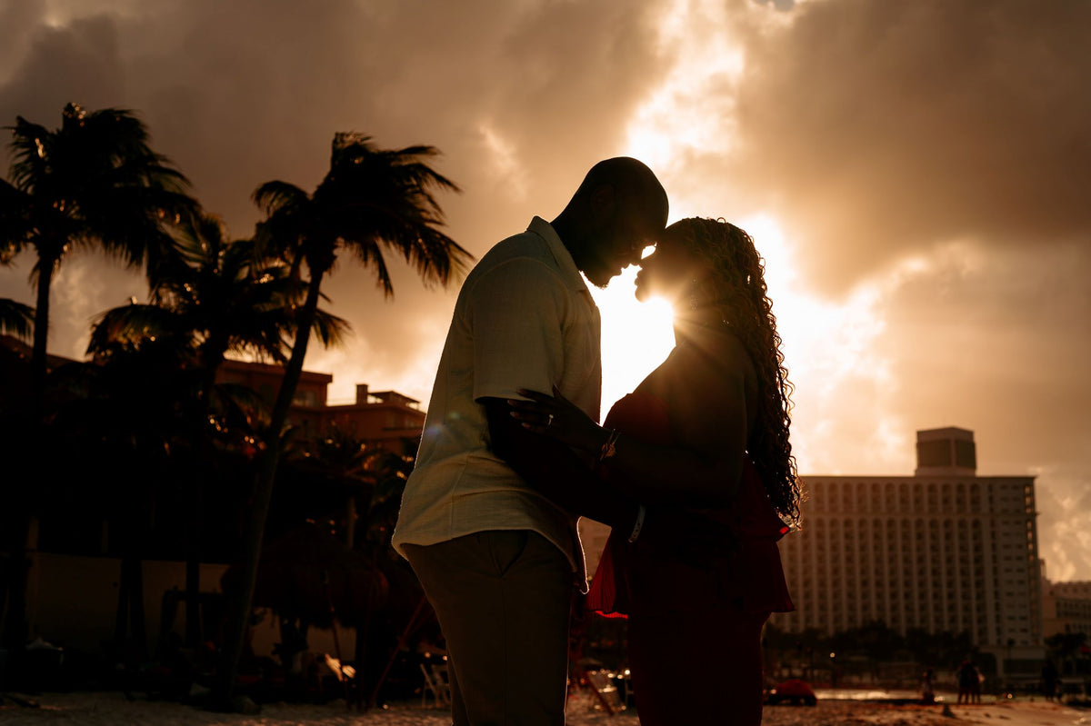 Photograph of couple embracing at golden hour, captured by a DreamArt photographer