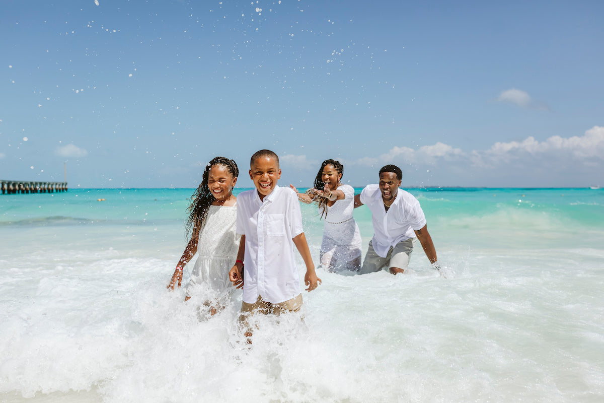 family playing in the water