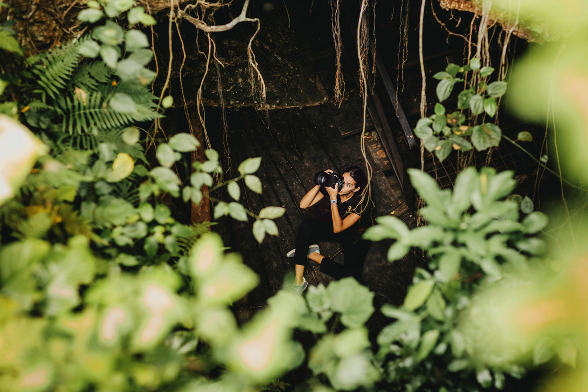 Josefina taking photos in the middle of the cenote