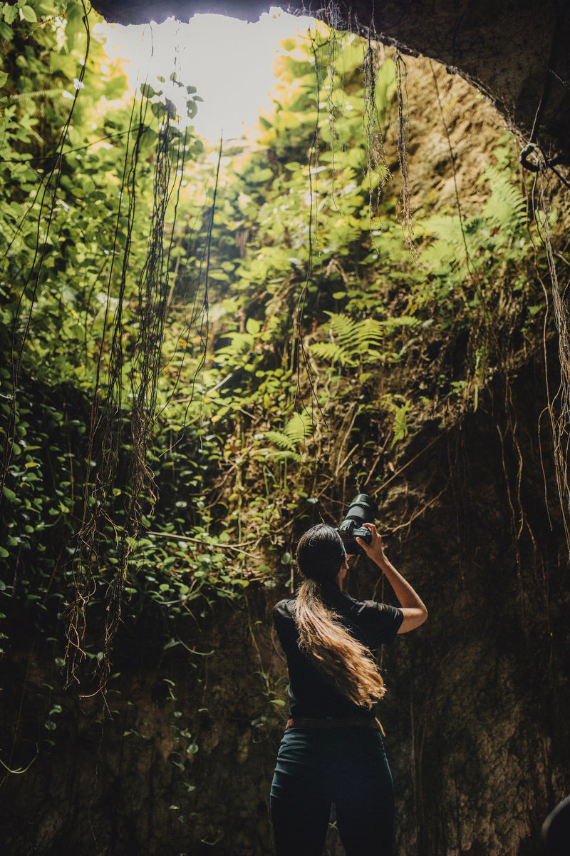 Josefina taking photos inside the open cenote