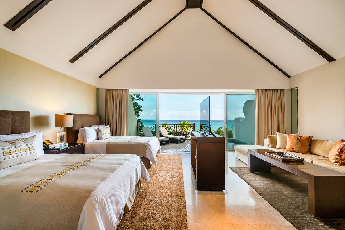 The same Grand Velas presidential suite after DreamArt editing, with straightened lines and brighter, cleaner light