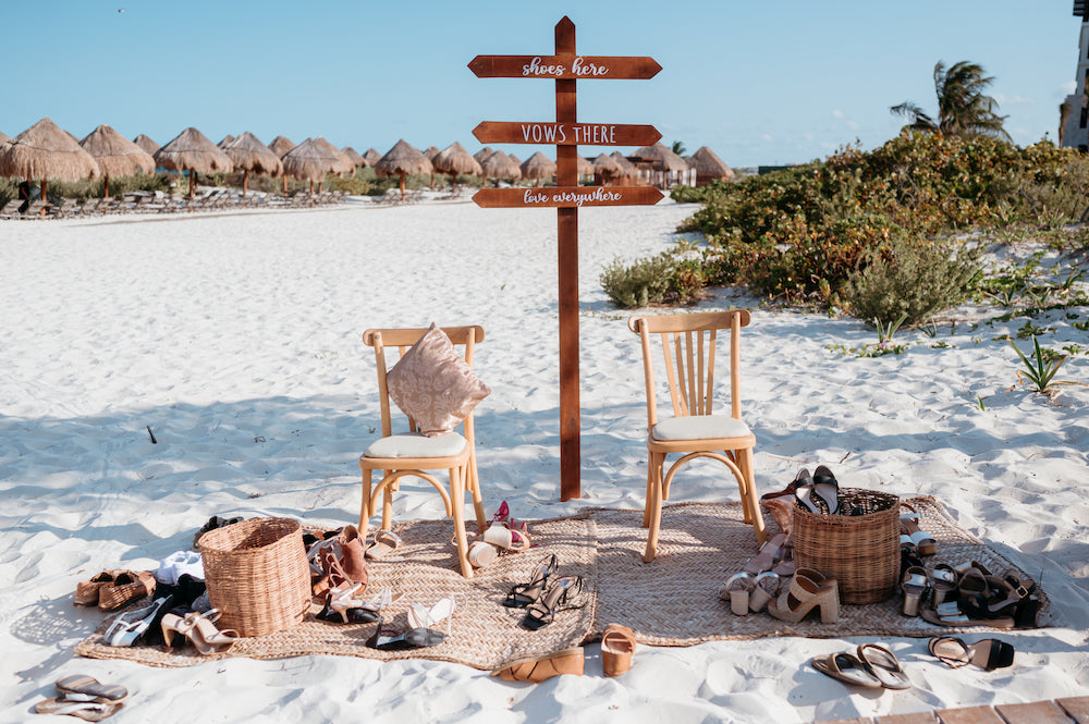 shoe station at beach wedding in the sand