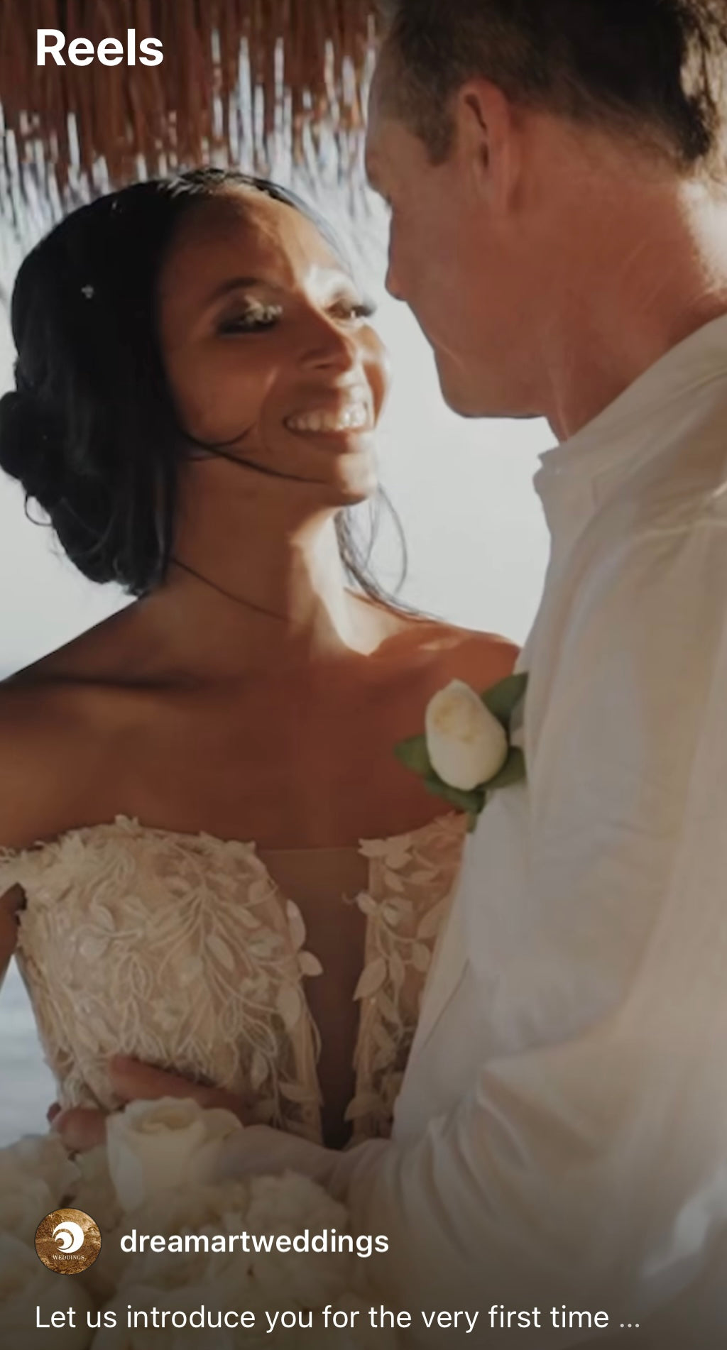 Wedding film reel cover of a smiling bride gazing at her groom under a palapa