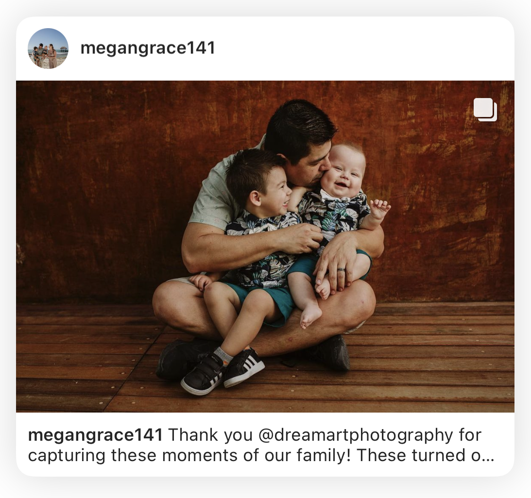 Instagram post from a client of a dad cuddling his two little boys on a wooden floor