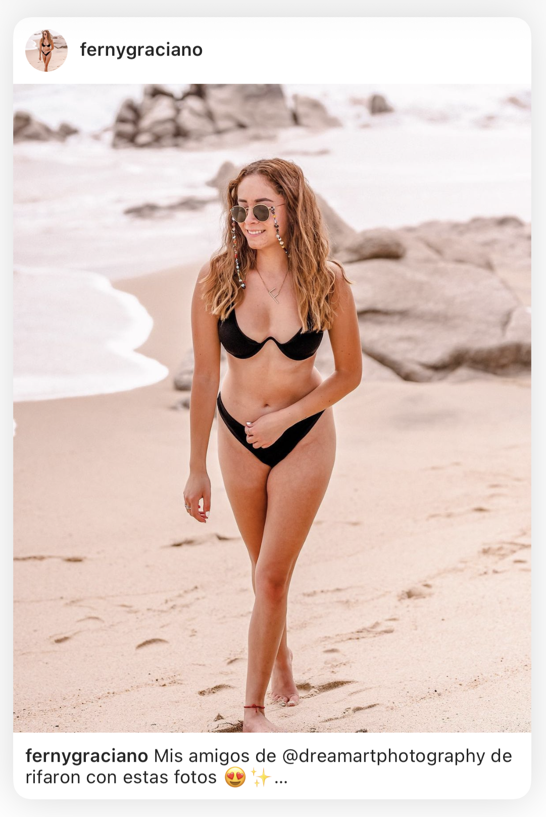 Client shares her beach photoshoot on Instagram, walking along the sand in a black bikini