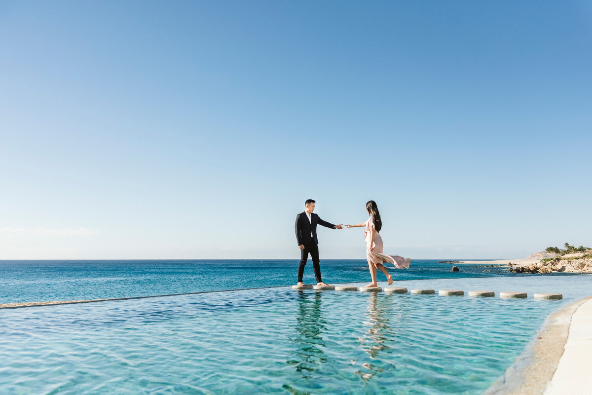 Melinda and Andrew engagement at the pool of Marquis Los Cabos