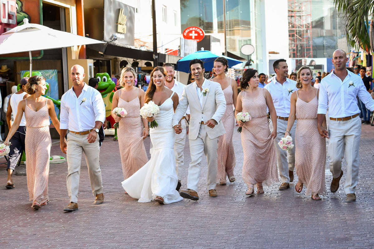 Wedding party walking in the fifth avenue of Playa del carmen