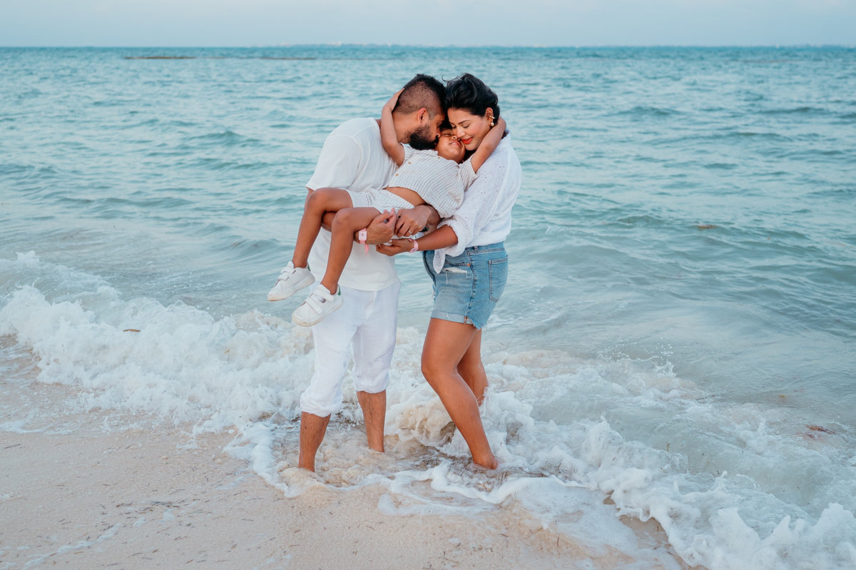 Family enjoying their SLS Playa Mujeres beach photoshoot