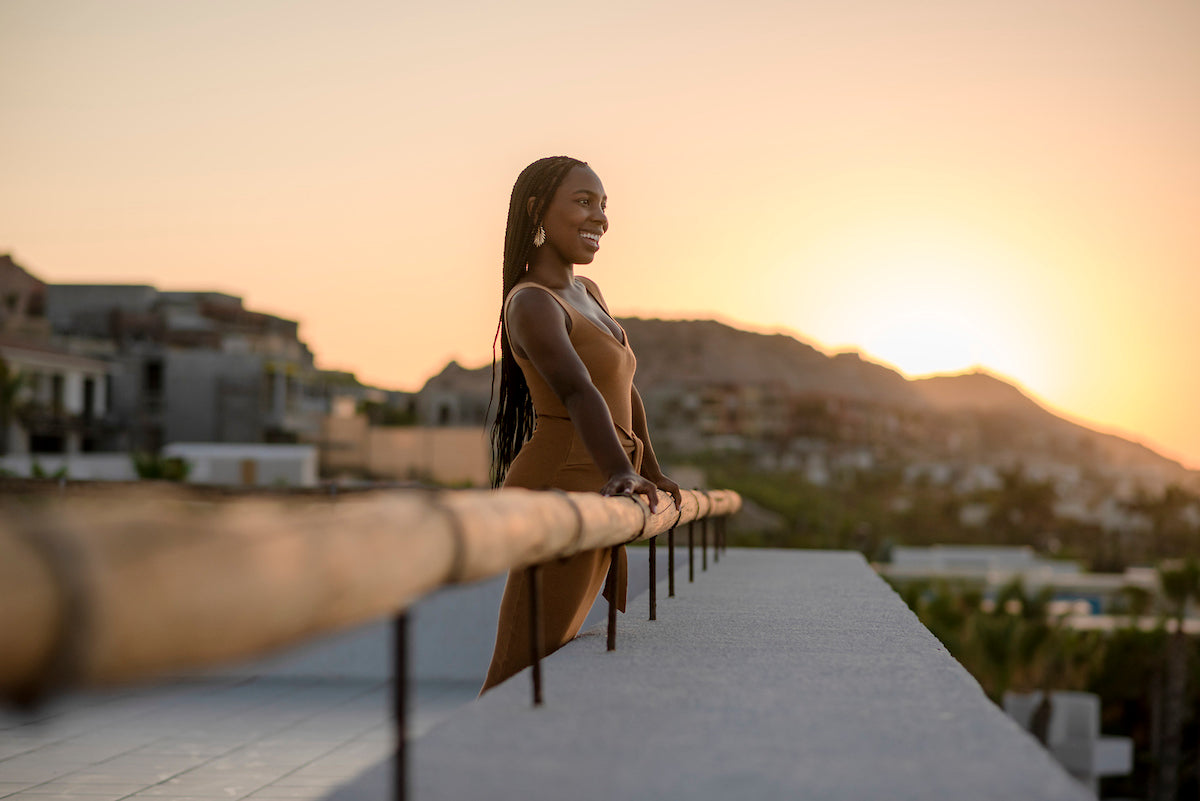 Afroamerican woman during the sunset at Los Cabos