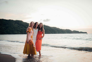 Three women posing on the beach for a DreamArt photographer, used for blog about Summer Trends 2025  