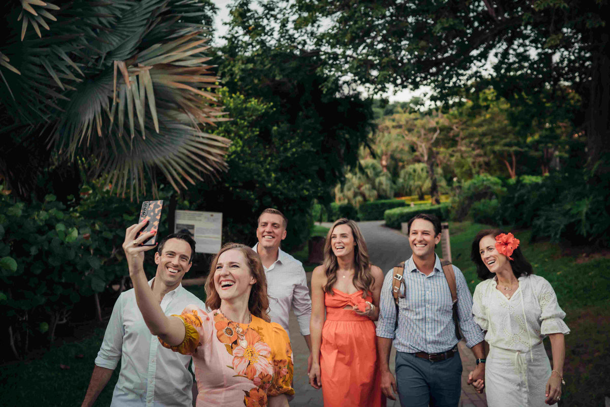 Image of a group of vacationers posing for a DreamArt photographer, used for blog about Summer Trends 2025