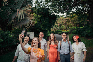 Image of a group of vacationers posing for a DreamArt photographer, used for blog about Summer Trends 2025  