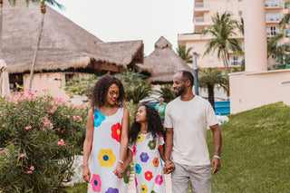 Image of family walking through a luxury hotel, posing for a DreamArt photographer, used for blog about Summer Trends 2025  