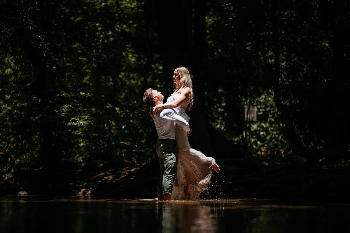 Photograph of a couple embracing in water, taken by a DreamArt Photography photographer