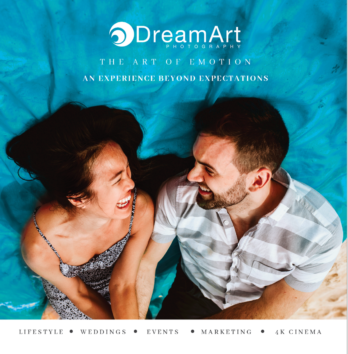 DreamArt Photography lifestyle brochure cover showing a laughing couple lying on turquoise fabric