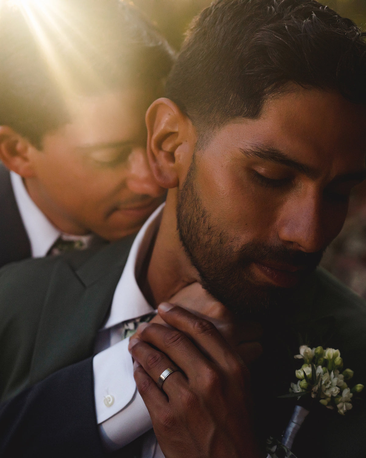 Close-up of a groom with a beard wearing a wedding ring at Valentin Imperial Riviera Maya