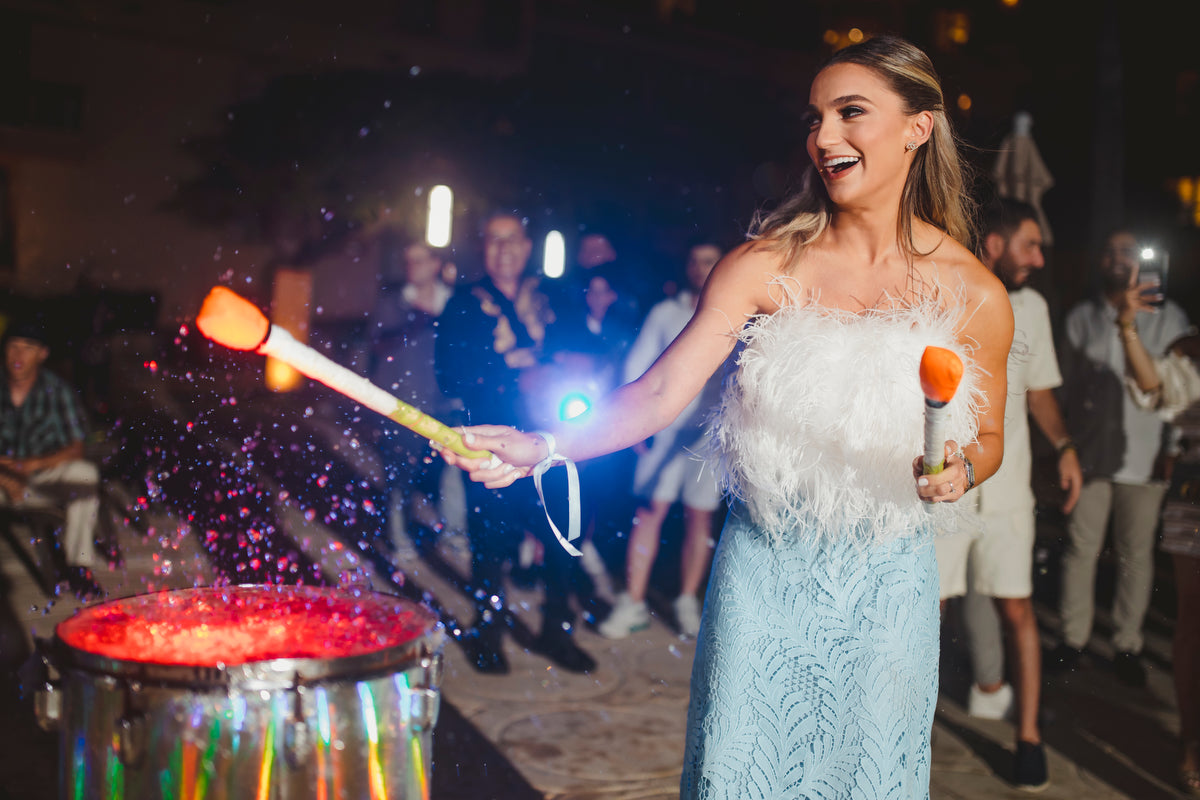 Bride playing the drums during the rehearsal dinner