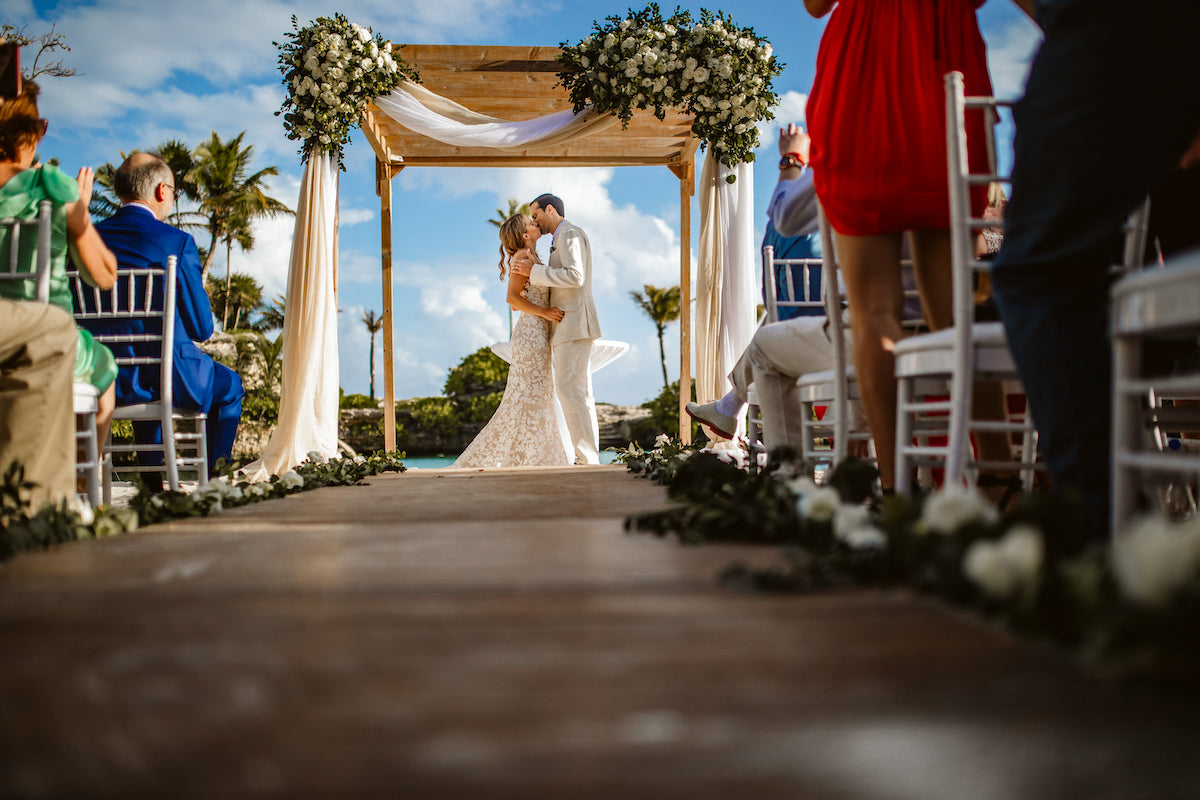 Bride and groom kissing during their ceremony