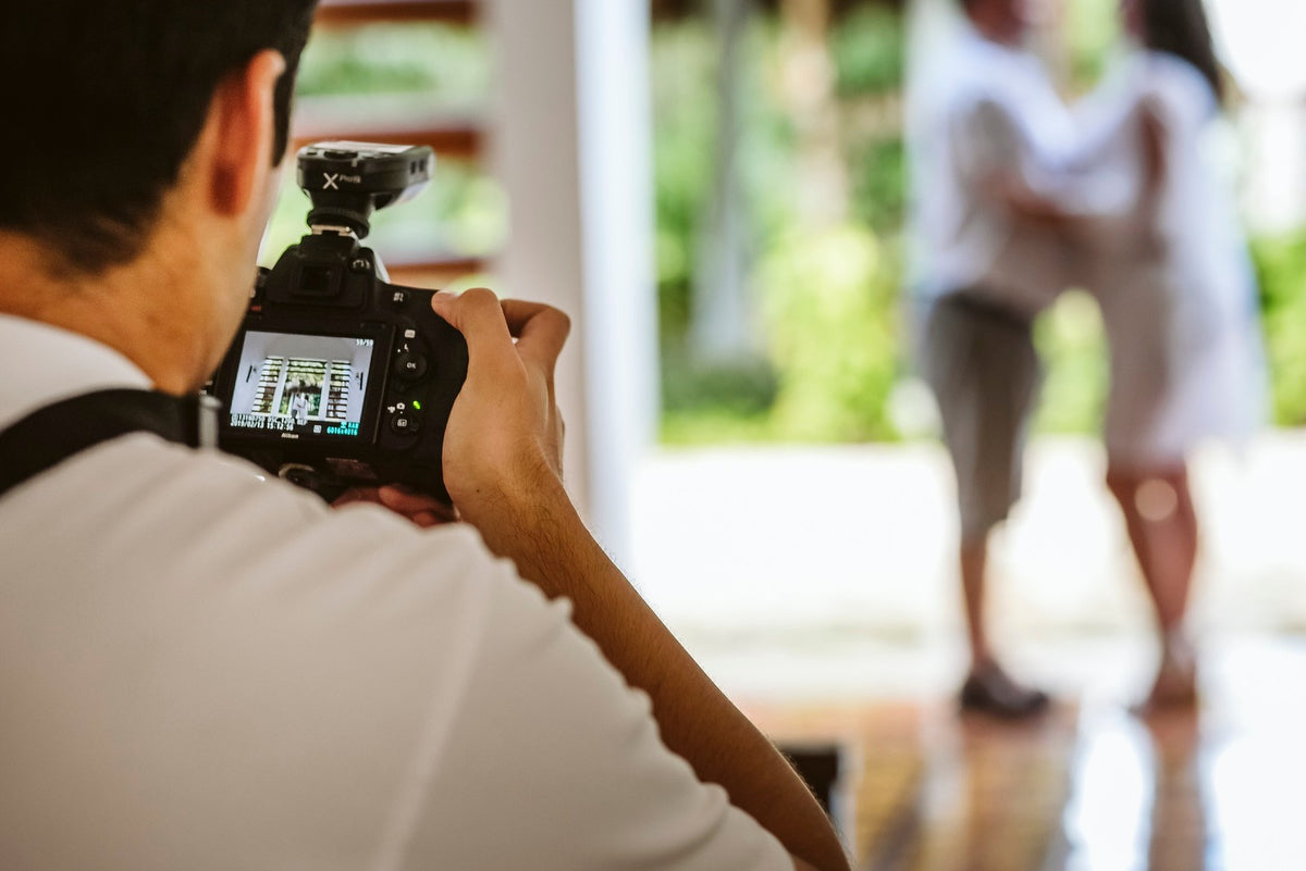 Photographer checking the camera during a photoshoot