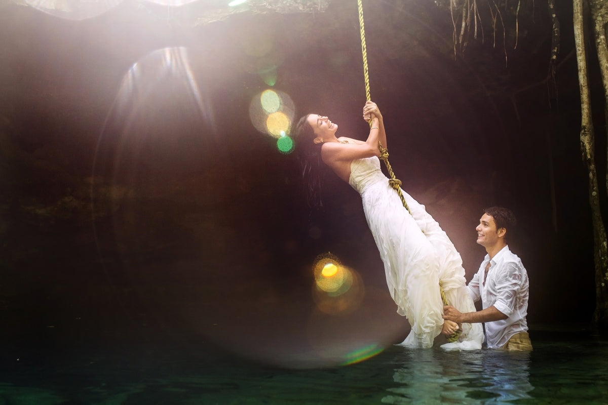 Clemence & Damian enjoying at the cenote in their trash the dress shooting