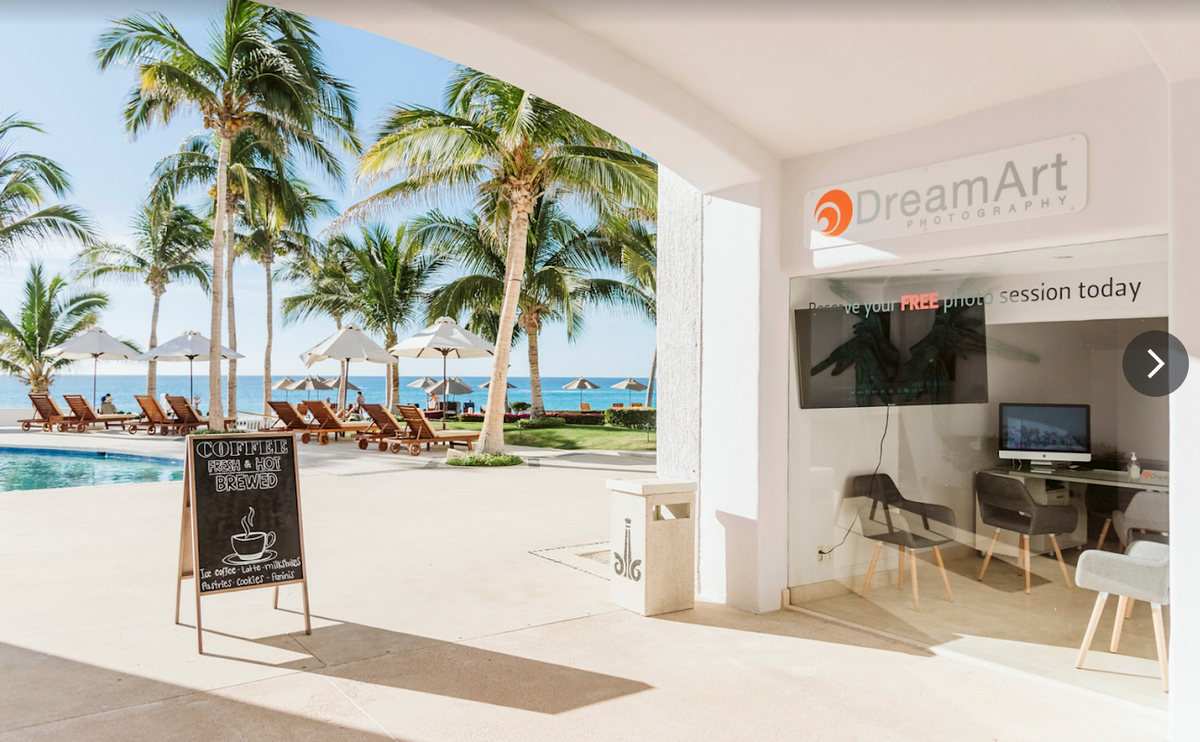 DreamArt Photography studio desk beside the pool and beach at Marquis Los Cabos