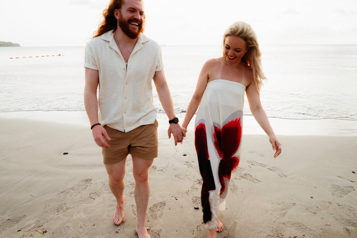Photograph of a couple walking on the beach holding hands, captured by a DreamArt Photographer at the Secrets St. Lucia