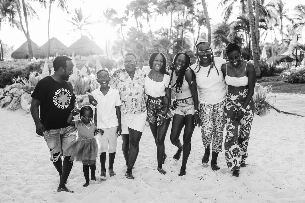 Family portrait walking on the beach at Vidanta Riviera Maya