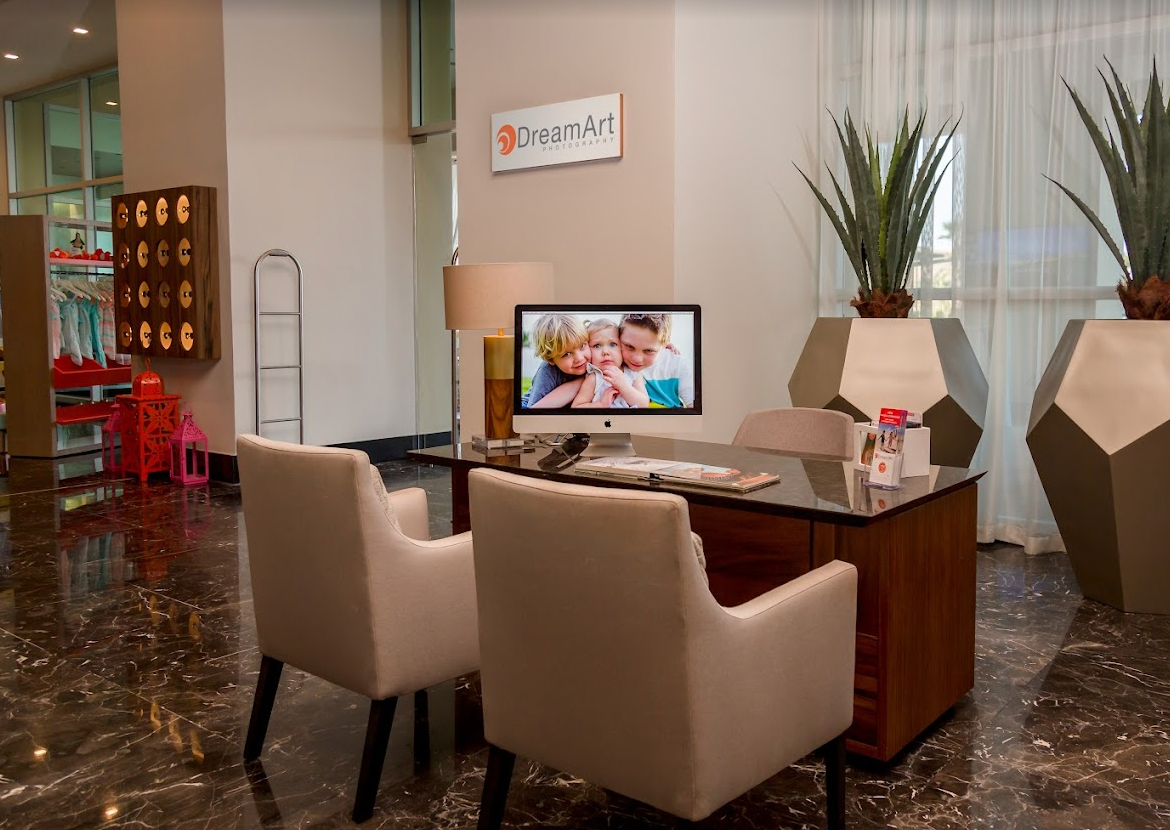 DreamArt Photography desk in the marble lobby at Vidanta Los Cabos